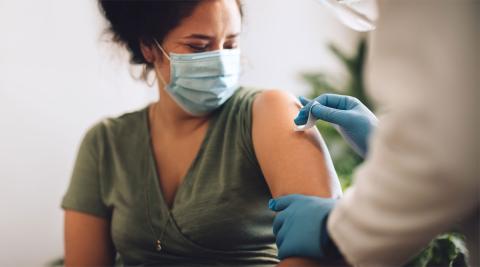 Woman receiving a covid vaccine shot